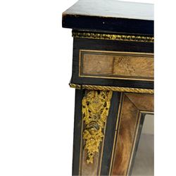 Victorian ebonised and walnut pier cabinet, rectangular top over figured frieze with central star motifs, enclosed by single glazed door, decorated with cast gilt metal mounts and beading, on chamfered plinth base 