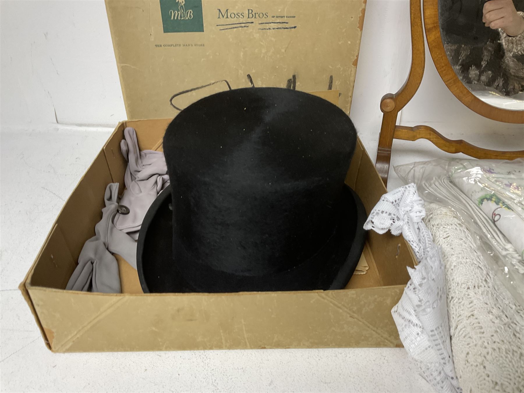 1960s Moss Bros black top hat, together with a wooden swing dressing table mirror and a collection of embroidered and other linen 