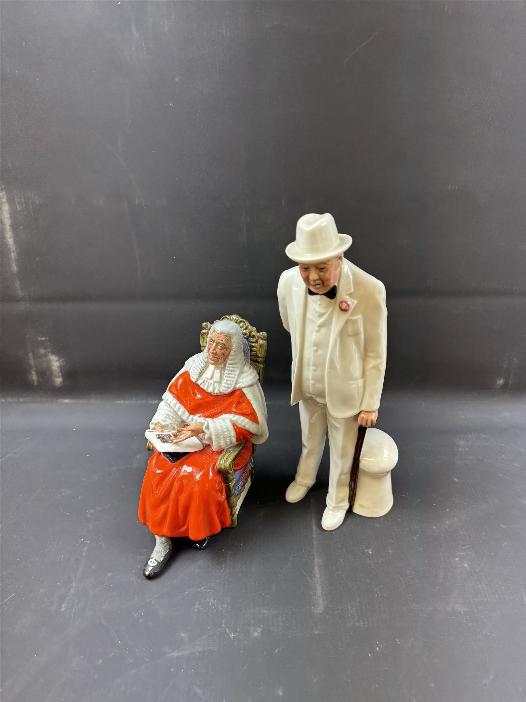 Two Royal Doulton figures, comprising Sir Winston Churchill HN3057 and The Judge HN2443