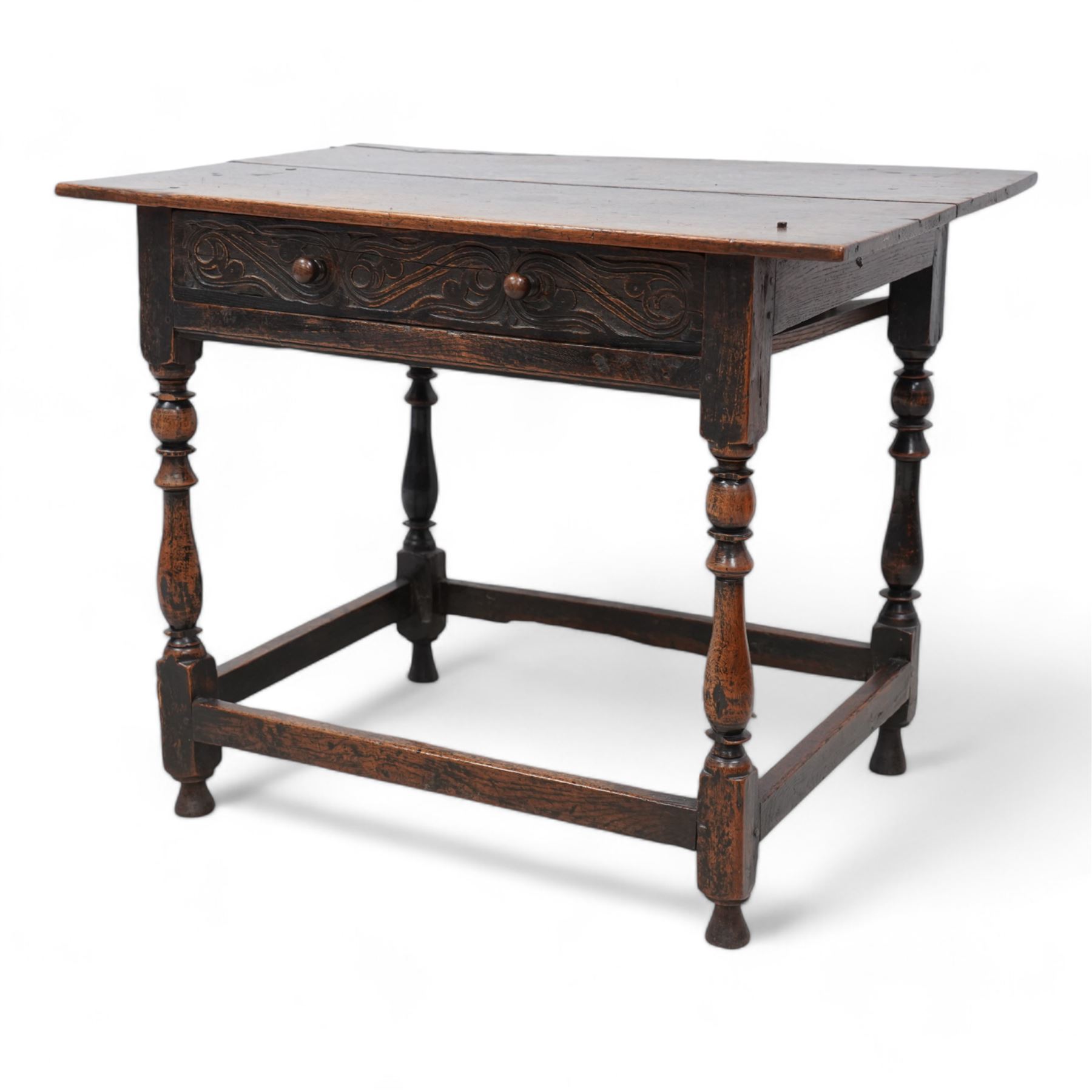 18th century oak side table, rectangular pegged two-plank top over singe drawer carved with S-scrolls, on turned supports united by plain stretchers 