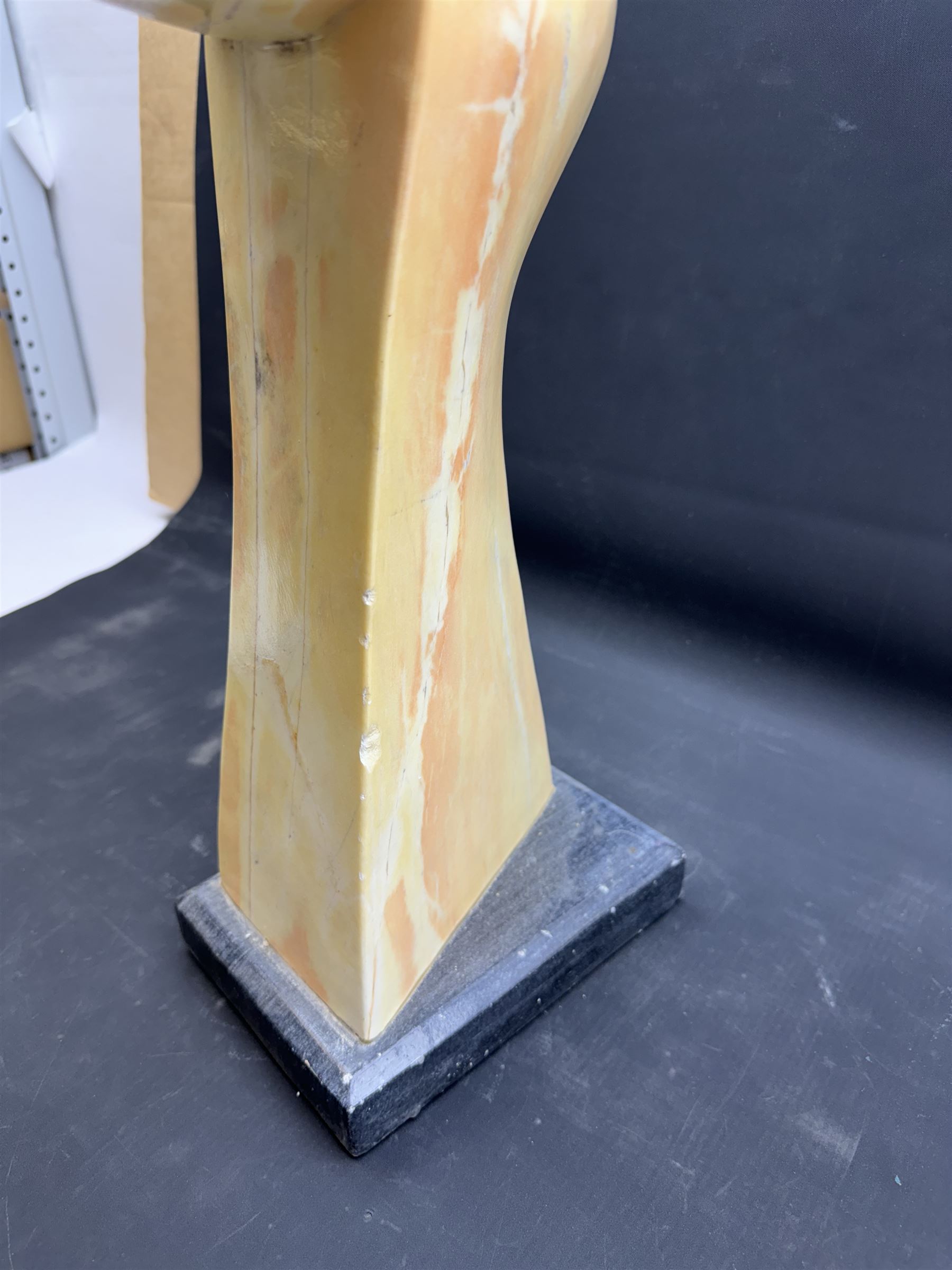 Abstract marble sculpture modelled as a dancer, upon a rectangular base, H58cm