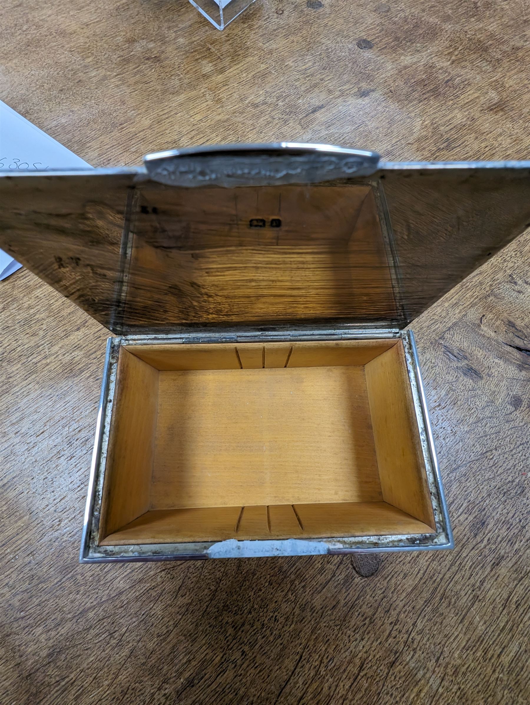 1930s silver mounted cigarette box, of rectangular form, with engine turned decoration and engraved cartouche to hinged lid, opening to reveal a softwood interior, hallmarked London 1930, maker's mark worn and indistinct