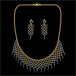 22ct white and yellow gold fringe necklace, with pair of matching 22ct gold stud earrings,...