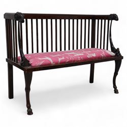 19th century mahogany two-seat bench, moulded cresting rail over slatted back with rams head carved terminal, the front arm supports in the form of fruit cornucopias, rectangular seat upholstered in pink fabric decorated with animals, anthemion carved supports carved as rams legs with hoof terminals 