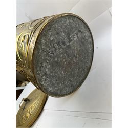 Arts and Craft brass coal box of cylindrical, with embossed stylised leaf panels, with twin handles, the cover with triform handle, H42cm 