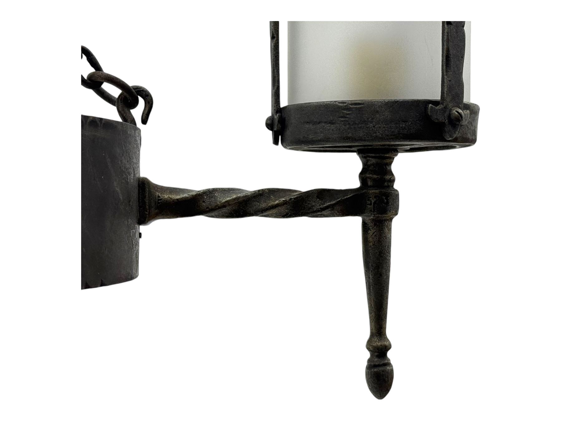 Wrought metal ceiling light, four branch with strapwork lanterns (D55cm); together with a pair of matching wall sconces (H32cm)