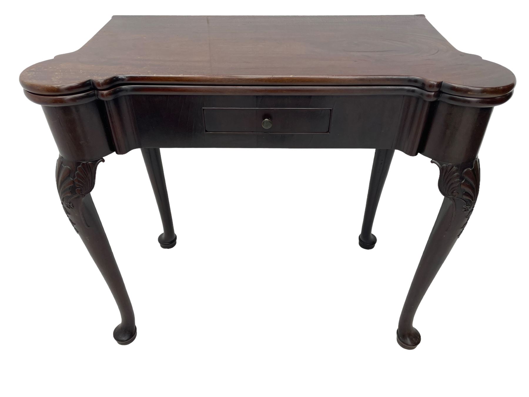 Late 18th century Irish mahogany tea table, rectangular form with projecting stepped rounded corners, fold-over action top over single frieze drawer within cock-beaded surround, on shell and bellflower carved cabriole supports, single gate-leg action base 