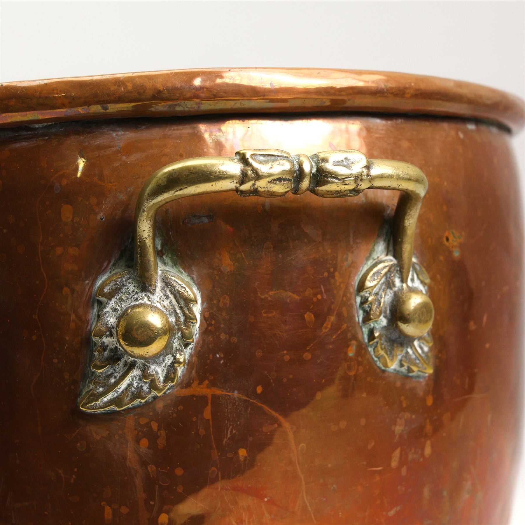 19th/ early 20th century copper coal bin, having twin cast brass handles, riveted base and three brass lion paw supports, H30cm, W42cm 