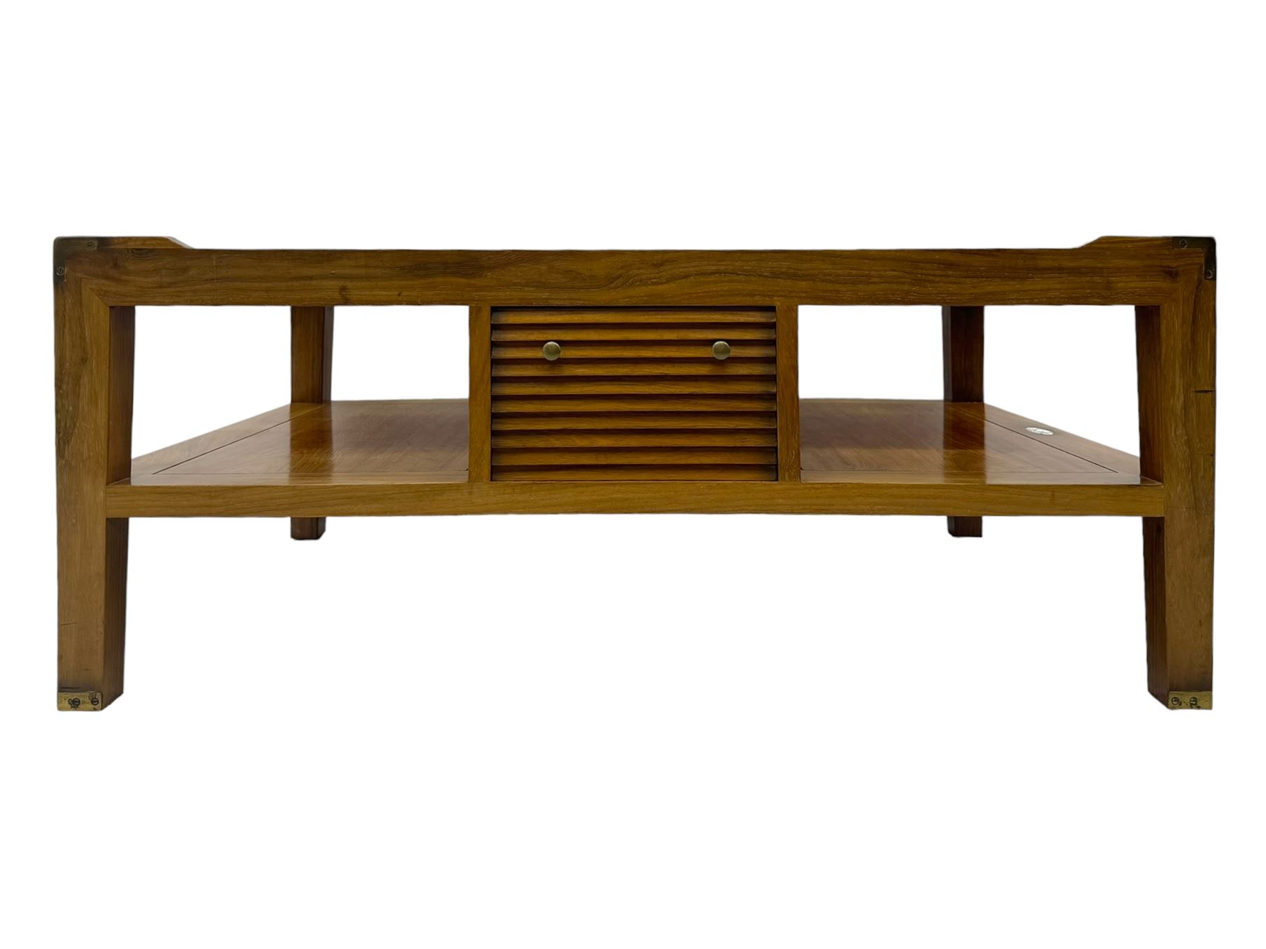 Starbay Tobago cherry wood coffee table, rectangular top with two inset glass panels, central drawer with louvred front and brass handles, flanked by open shelving, raised on square supports with metal corner brackets