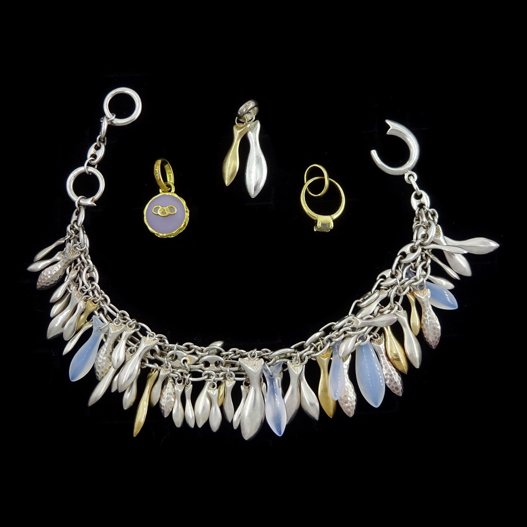 Links of London jewellery including 18ct gold stone set ring pendant / charm, hallmarked, silver fish bracelet, three silver strands with 18ct gold, silver and moonstone fish pendants, matching 18ct gold and silver pendant and a silver-gilt lavender macaron pendant / charm