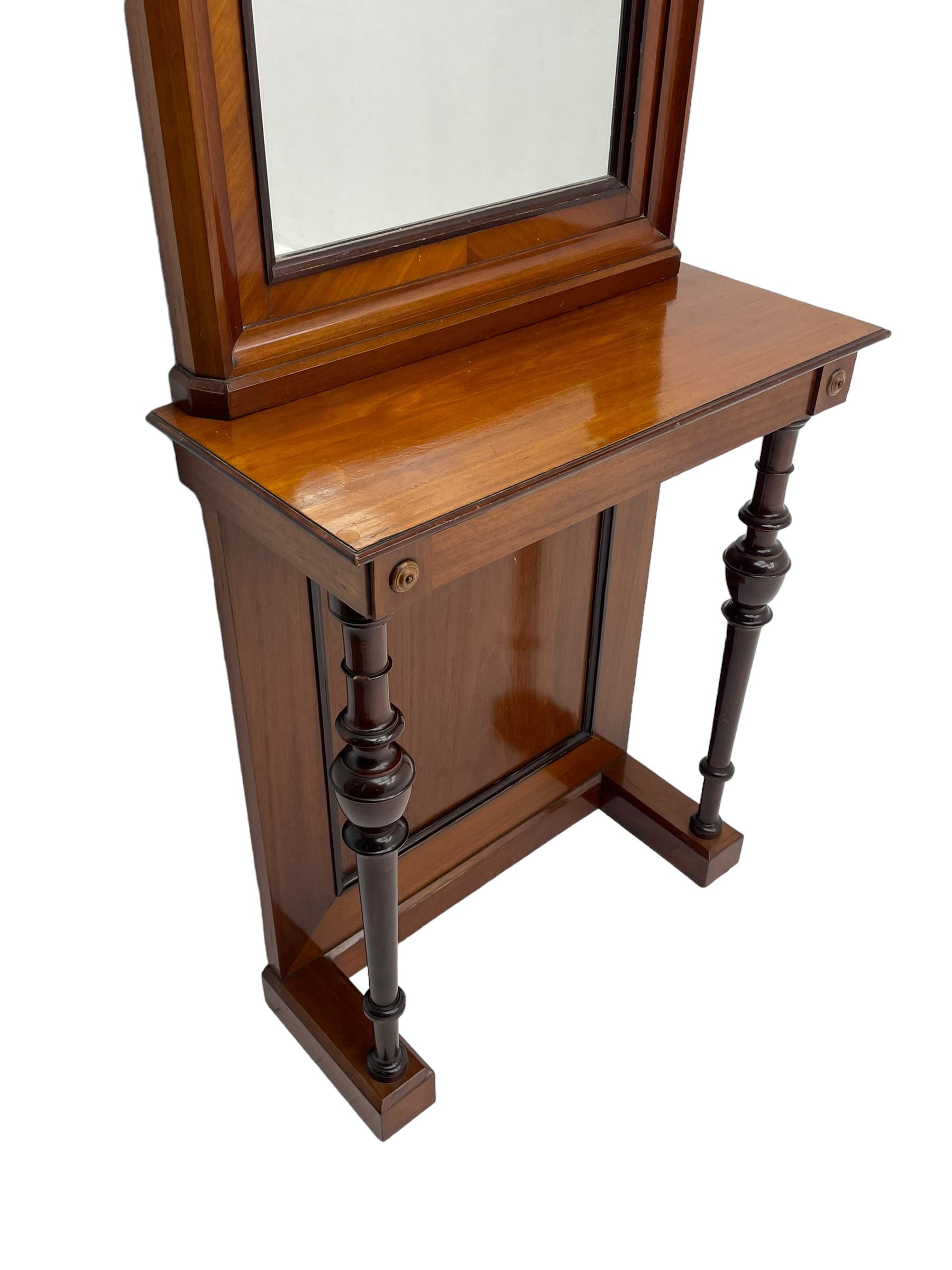 Late 19th to early 20th century walnut hallway console table with pier mirror, tall rectangular mirror with ovolo-moulded cornice, plain mirror plate surrounded by moulded slip and crossbanding, rectangular top over panelled back supports by turned supports, on sledge feet 