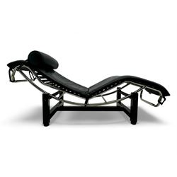 After Le Corbusier, Pierre Jeanneret, and Charlotte Perriand - LC4 chaise longue, black leather upholstery with cylindrical headrest, supported by a chromed tubular steel frame, with cantilever design with elastic webbing