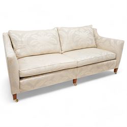 Duresta - Grande hardwood-framed three-seat sofa, upholstered in pale fabric decorated wit...