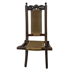 Victorian Aesthetic Movement mahogany framed folding campaign chair, pierced and carved cresting rail with carved and chamfered uprights, rattan back and seat