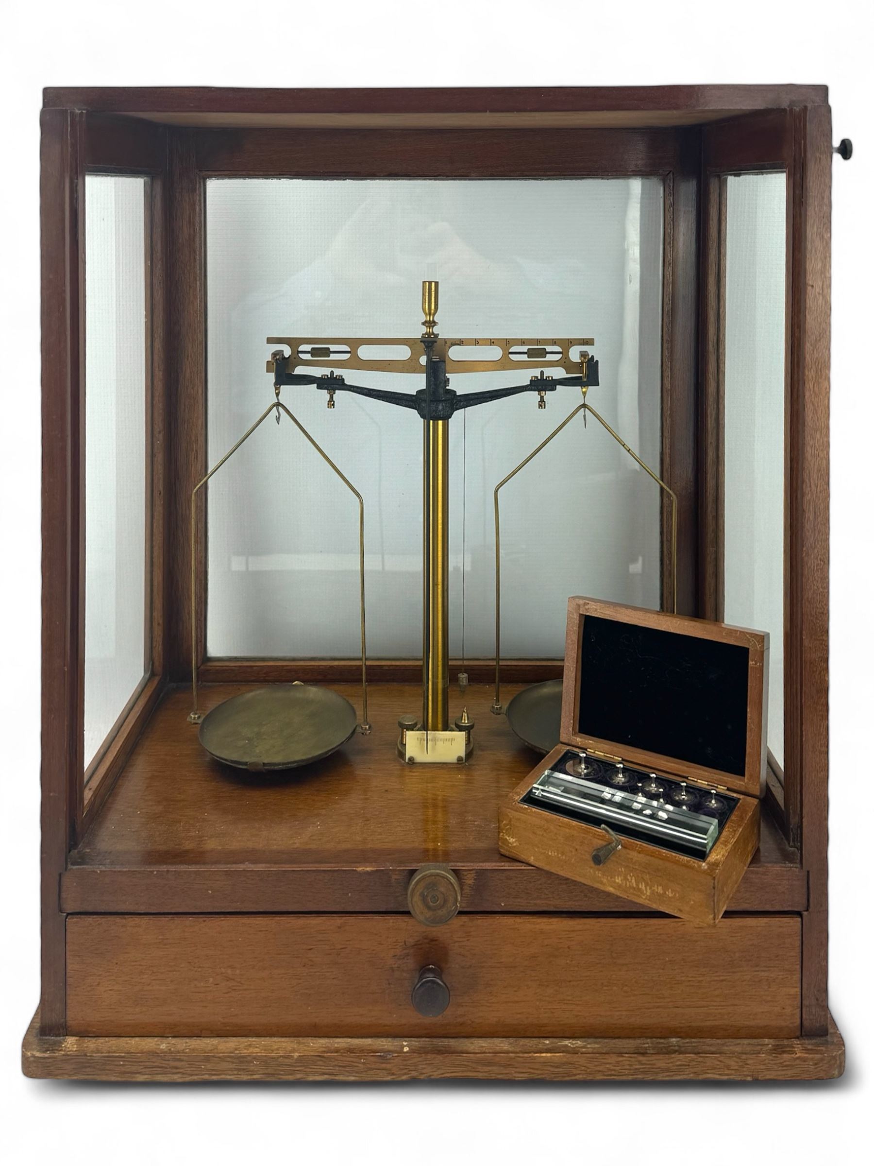 Early 20th century mahognay cased set of balance scales by James H Heal & Co Ltd with associated cased weights, H53cm x W44cm 