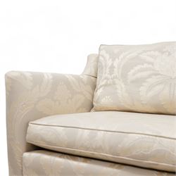 Duresta - Grande hardwood-framed three-seat sofa, upholstered in pale fabric decorated with repeating foliate pattern, on square tapering supports with brass castors 