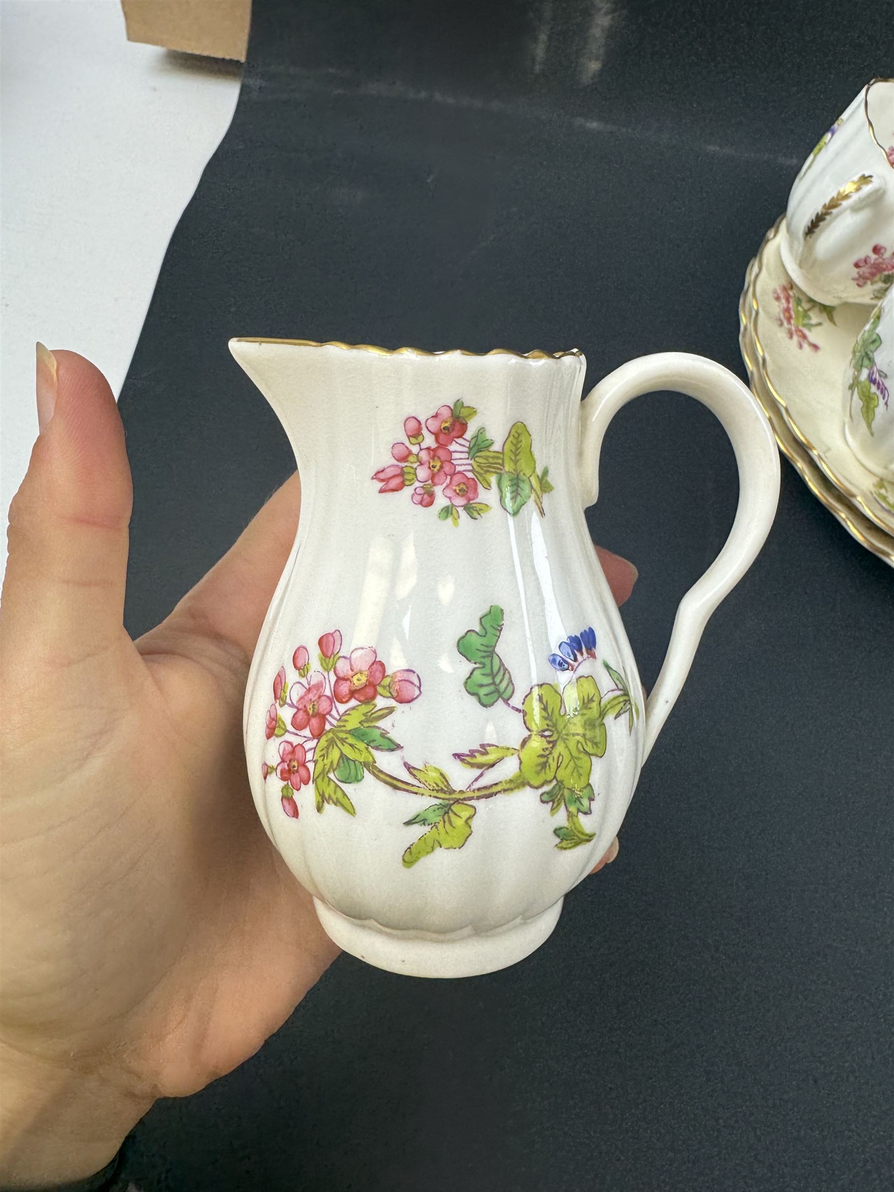 Coalport part tea service, decorated with floral sprigs, including eight cups and saucers, milk jug, eight dessert plates etc  