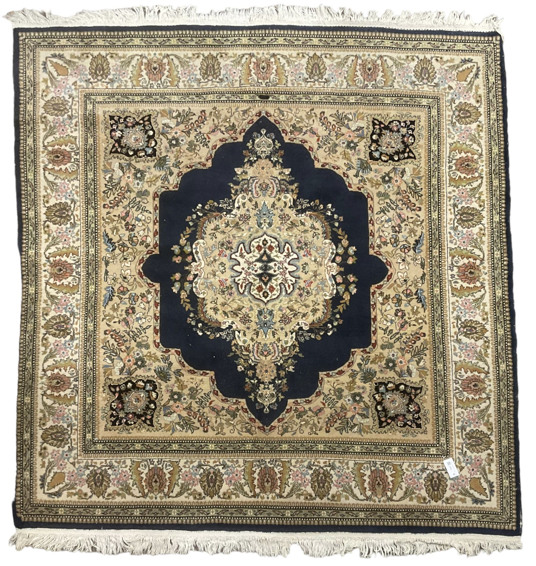 Persian Kirman indigo ground rug, central floral design medallion with matching spandrels, the guarded border decorated with stylised plant motifs 