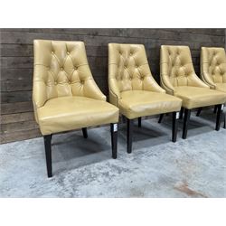 Four high back chairs upholstered in buttoned beige leather, studded detail, rosewood legs