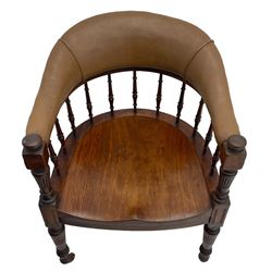 Pair of late Victorian walnut tub-shaped elbow chairs, the cushioned cresting rail upholstered in leather on spindle turned supports, dished saddle seat on turned supports