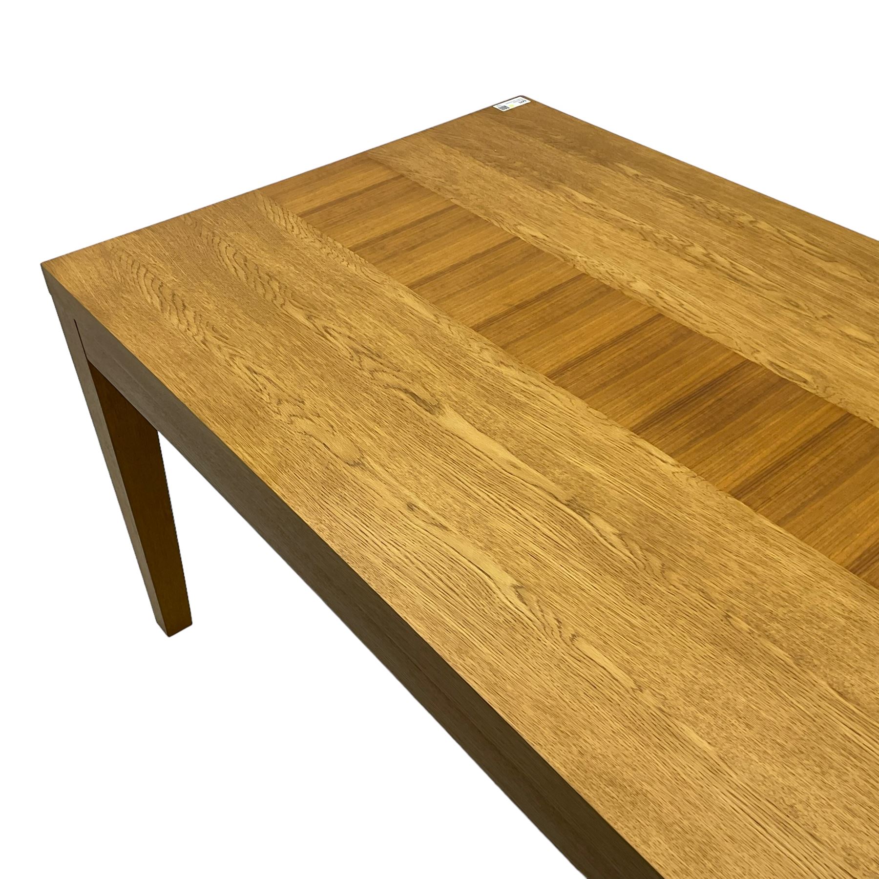 Contemporary oak dining table, rectangular top with inlaid walnut central strip, on square tapering supports 