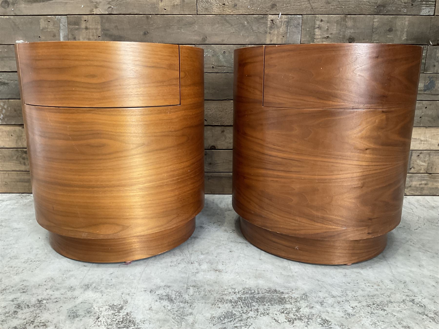 Pair of walnut circular barrel shaped lamp tables, fitted with single drawer