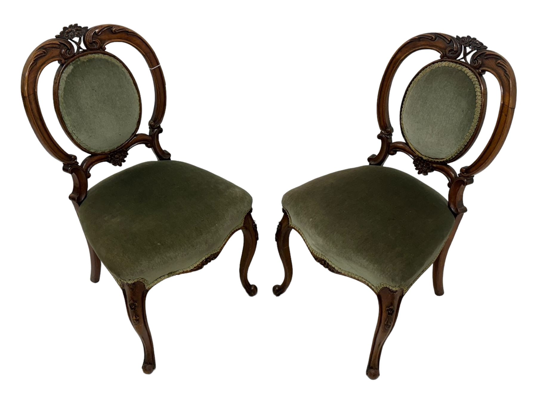 Pair of Victorian mahogany salon chairs, carved and pierced cameo back with scrolling acanthus leaf decoration and c-scrolls, upholstered in sage green fabric, on cabriole supports with floral mouldings