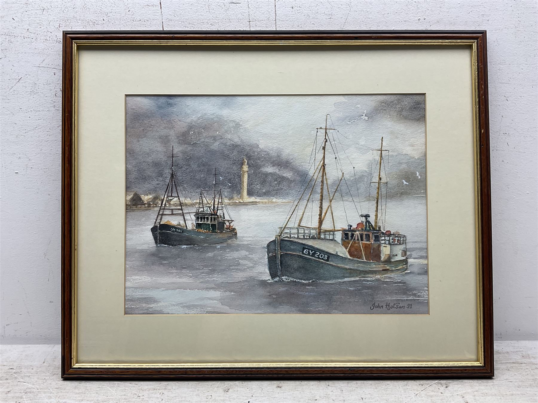 John Hotson (British 20th century): Grimsby Fishing Trawlers at Sea, watercolour signed and dated '91, 28cm x 38cm