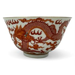 Chinese porcelain iron red tea bowl, the exterior painted with two five claw dragons chasi...