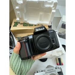 Collection of Nikon cameras, to include N65 serial no. 3103095, boxed, AF F-601 serial no. 2049522, boxed, F-801s serial no. 3330641, F-301 serial no. 3349050 and two Nikkormat cameras, to inlcude an EL example serial no. 5236494, with a nikkor Zoom 43-86mm 1:35 lens serial no. 913104, boxed and one other