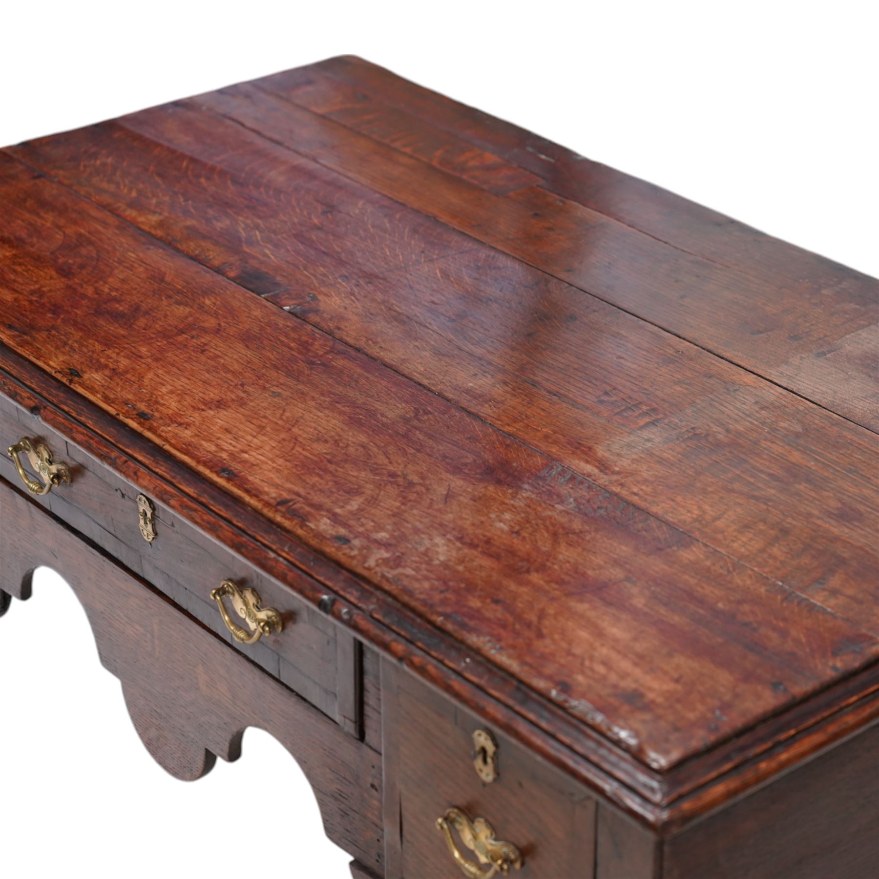 18th century oak low-boy, moulded rectangular top over three drawers and shaped apron, the mahogany banded drawer fronts fitted with shaped brass handles, on cabriole front supports and square tapering rear supports 