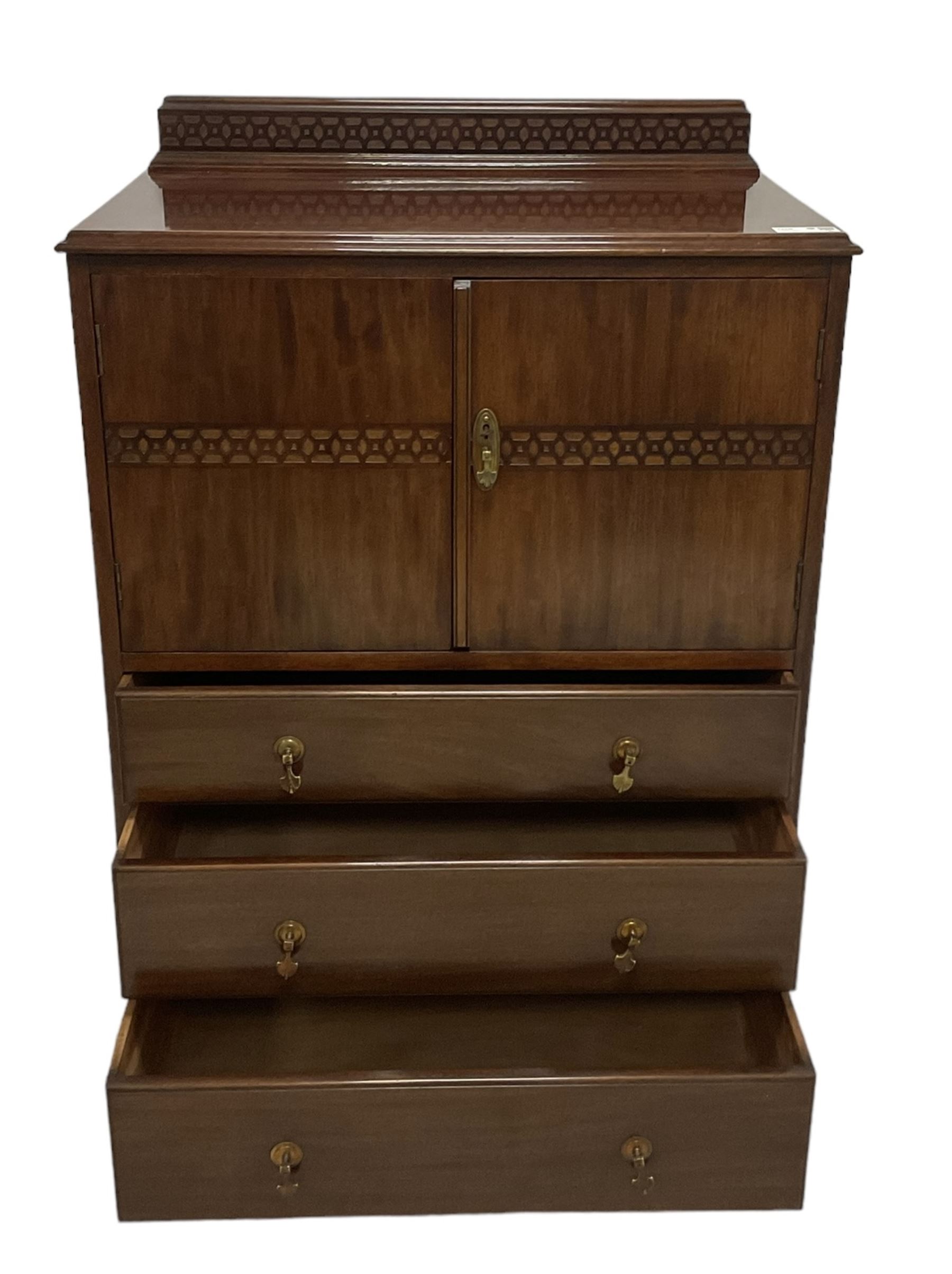 Early 20th century mahogany tallboy, double cupboard over three drawers, on ball and claw carved cabriole feet