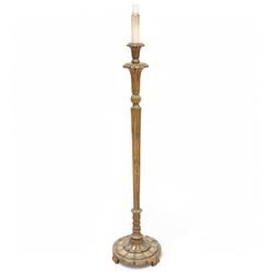 Late 20th century gilt wood standard lamp, turned and reeded column on lappet carved circular base 