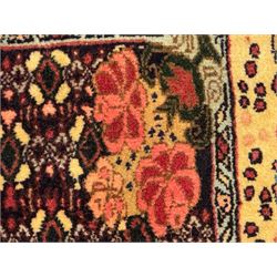 Kurdish rose ground runner rug, set with a series of ten floral medallions on linked field, the border decorated with stylised flower heads and bird motifs 