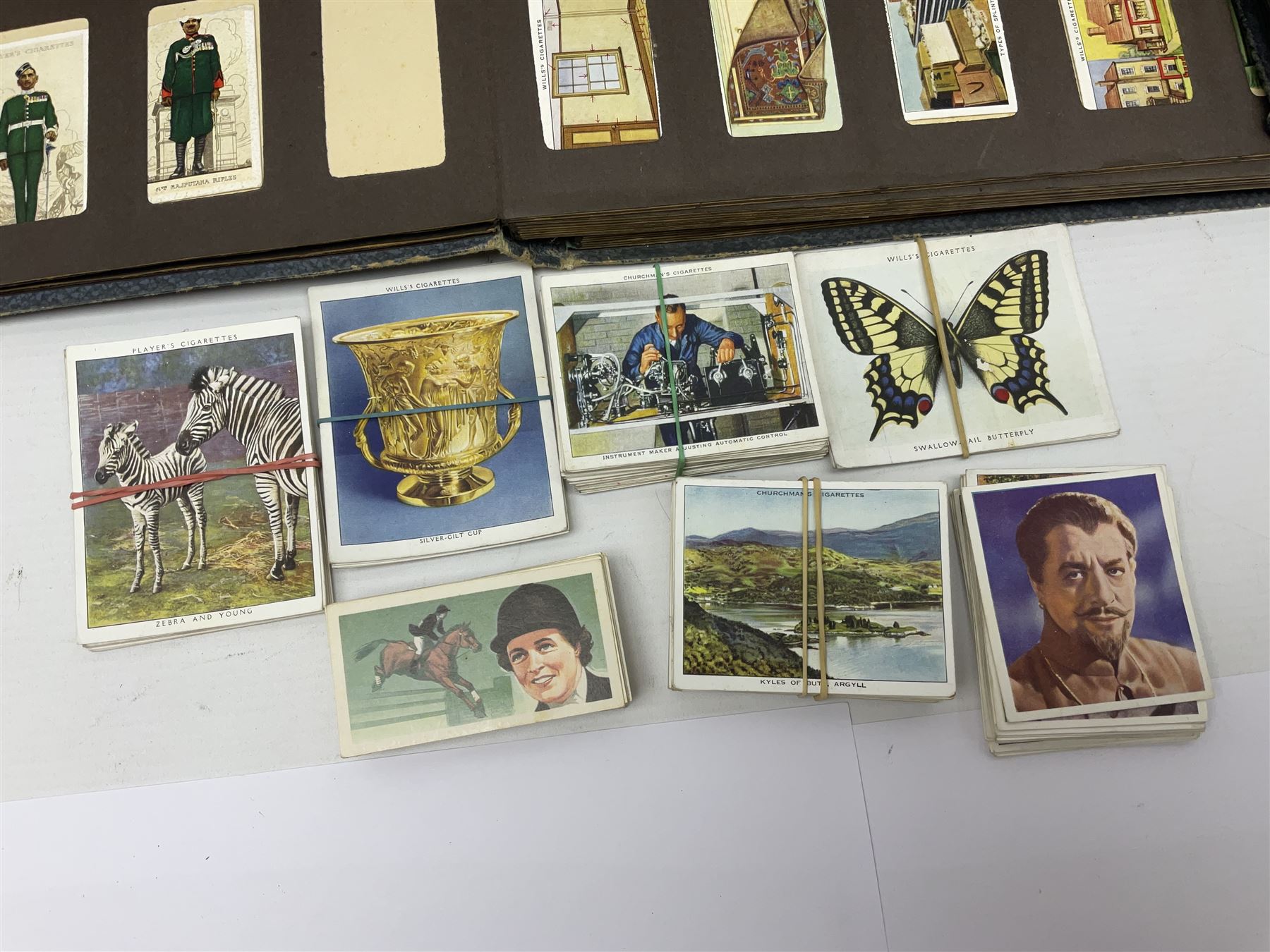 Four albums of cigarette cards, including Will's and Player's examples