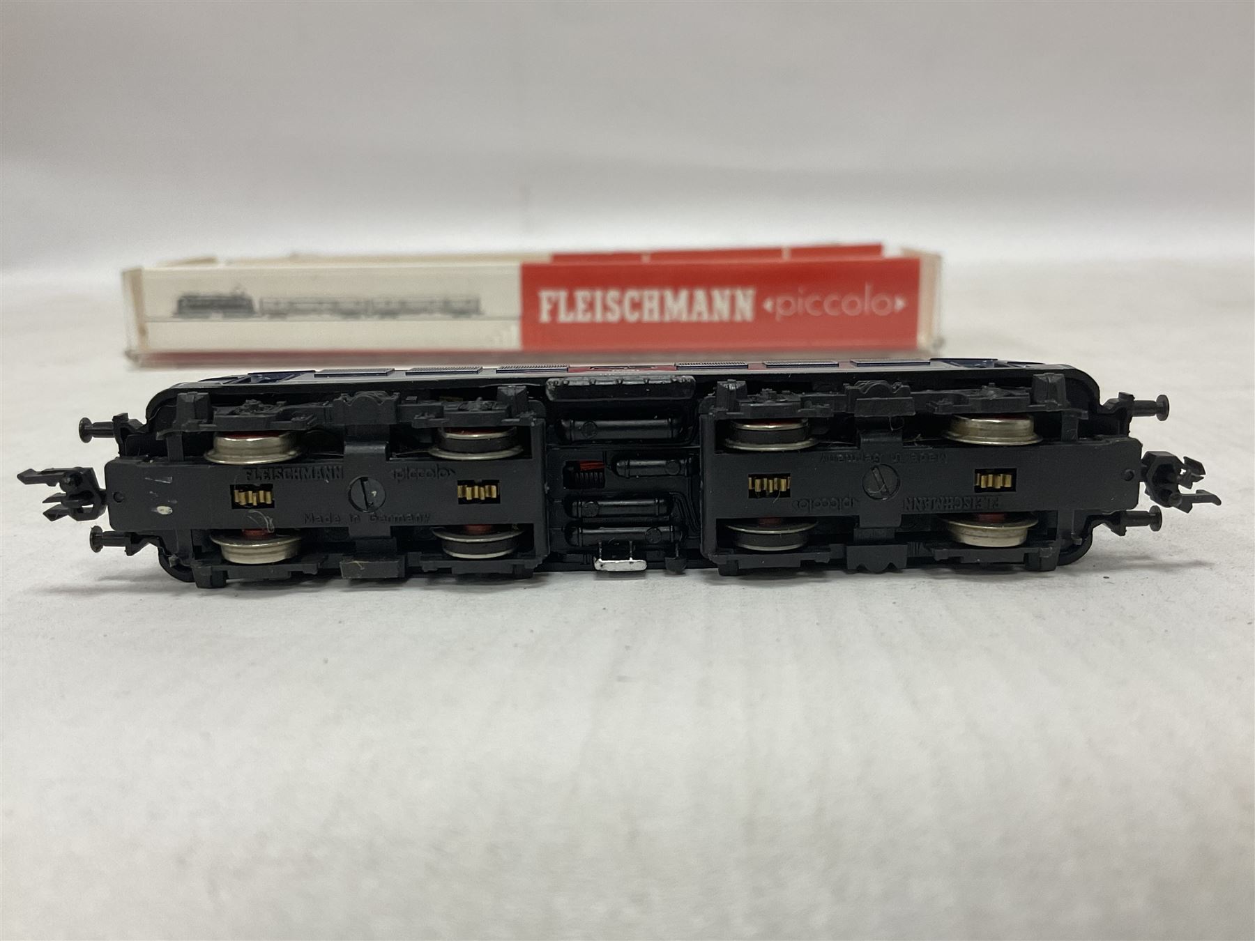 Fleischmann ‘N’ gauge ‘Piccolo’ - Black tank engine no.7000, brown diesel shunter no.7230, boxed dark blue electric locomotive with pantograph no,7335 and dark green class 132 locomotive with pantograph no.7369 (4) 