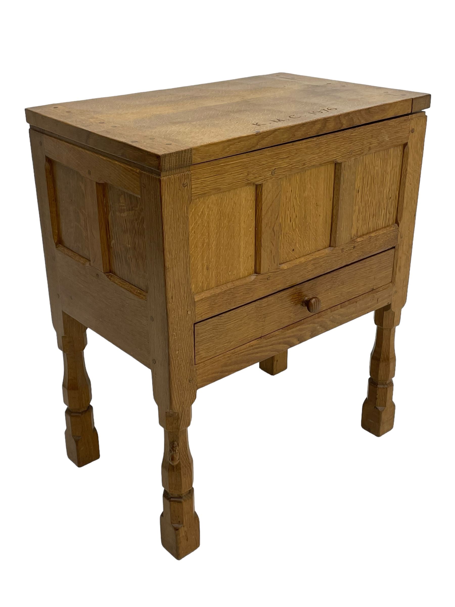 Mouseman - oak work or sewing box, rectangular adzed top inscribed 'L. M. C. 1976' enclosing vacant interior, triple panelled front and double panelled sides, fitted with single drawer, on octagonal supports, carved with mouse signature, by the workshop of Robert Thompson, Kilburn 