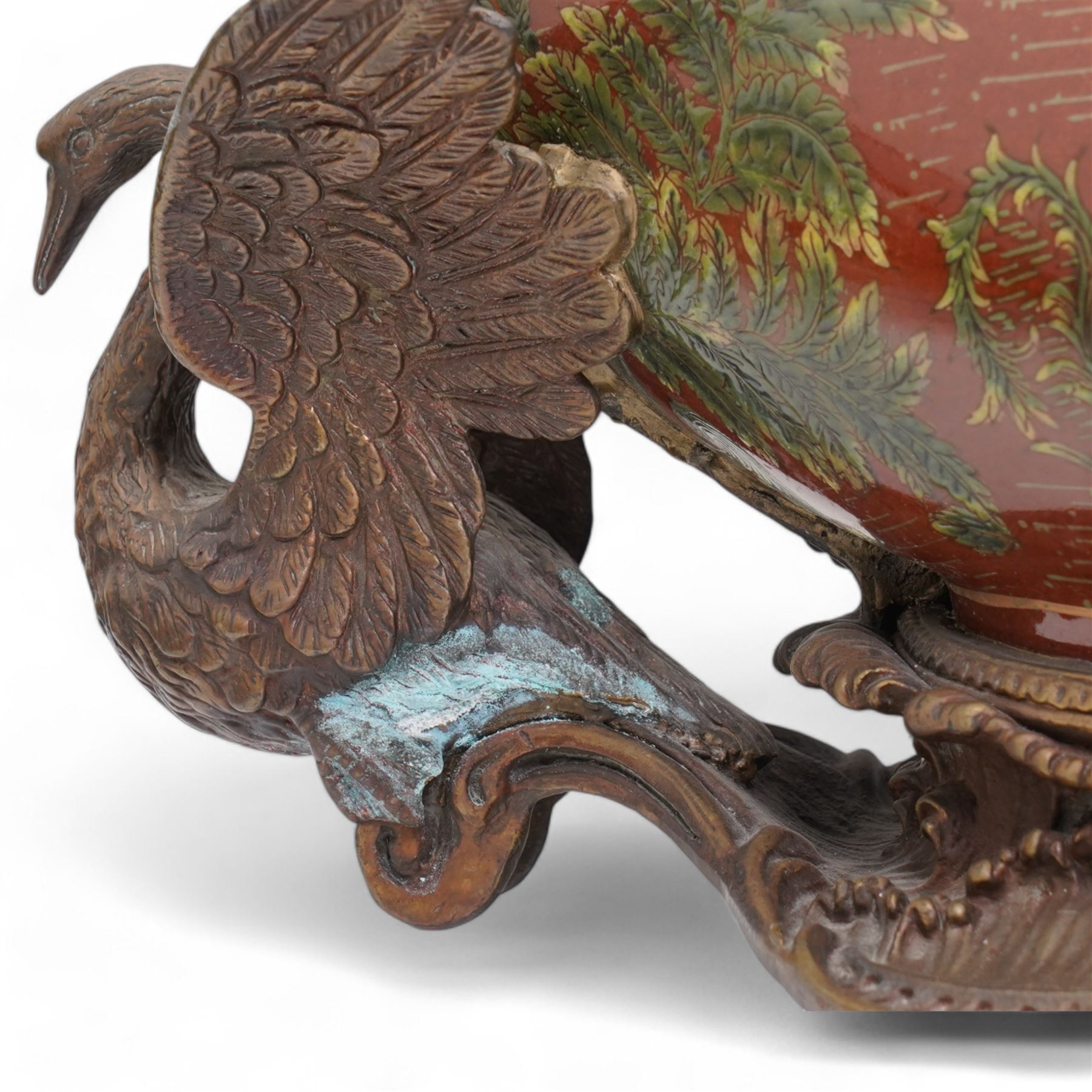 Pair of Continental ceramic and patinated metal table centre pieces, possibly by Castilian, each of boat form with pierced and polychrome decoration, with swan and shell moulded supports, H31cm x L46cm