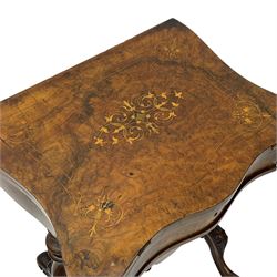 Victorian inlaid figured walnut games table, the serpentine fold-over top inlaid with scrolling foliate decoration, the top opens to reveal cribbage, backgammon and chess boards, single drawer over sliding storage well, on twin pillar supports united by double turned stretchers, on foliage carved out-splayed supports with brass and ceramic castors 