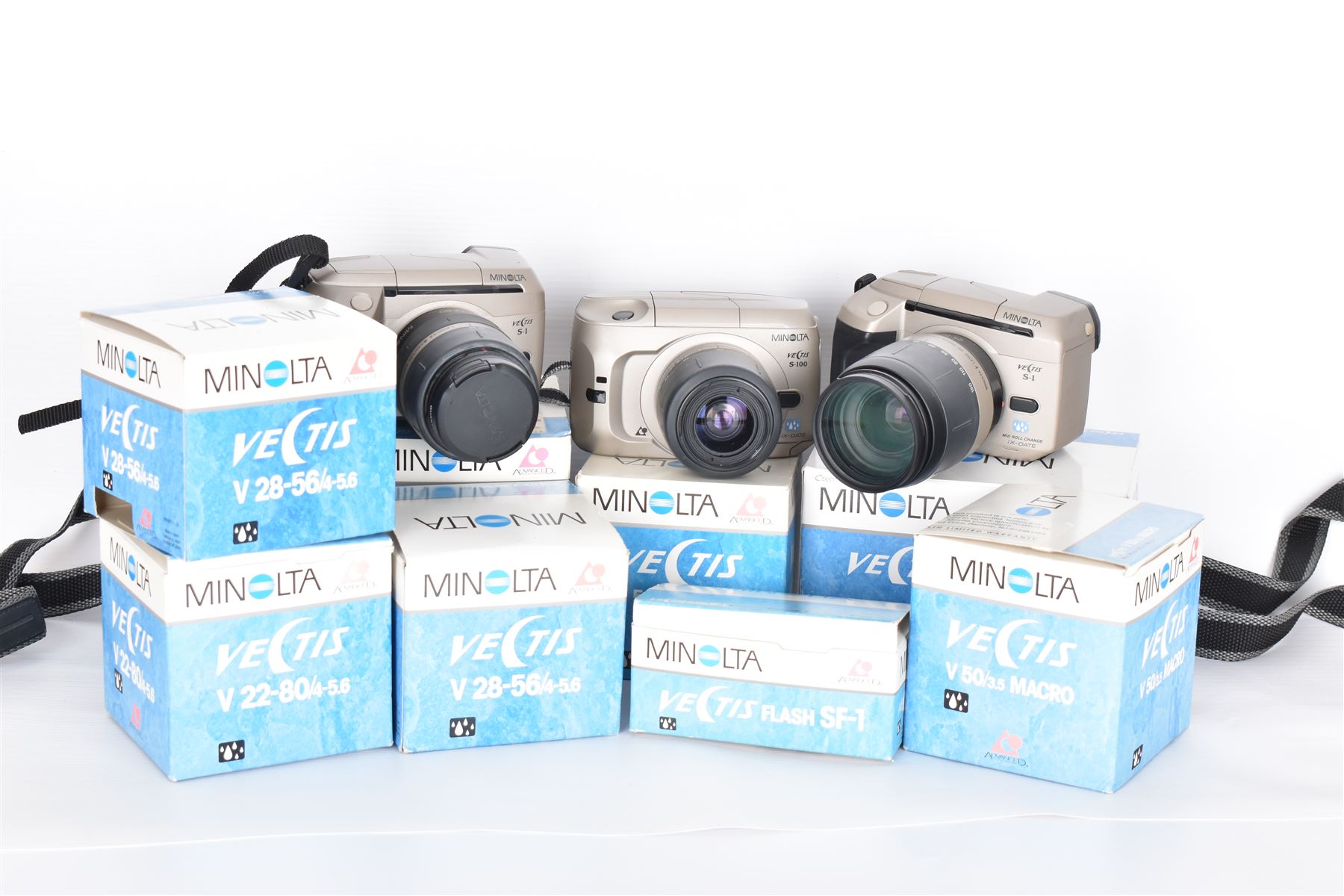 Four Minolta Vectis cameras bodies, to include two Vectis S-1 examples, serial nos. 96622420 & 02629088 and two Vectis S-100 examples, serial nos. 98713950 & 98704095, together with a collection of Minolta Vectis accessories and lenses, including boxed examples