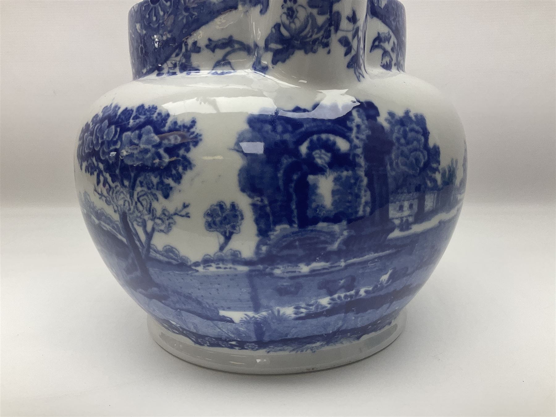 Large blue and white jug, decorated with landscape transfer print, H24cm