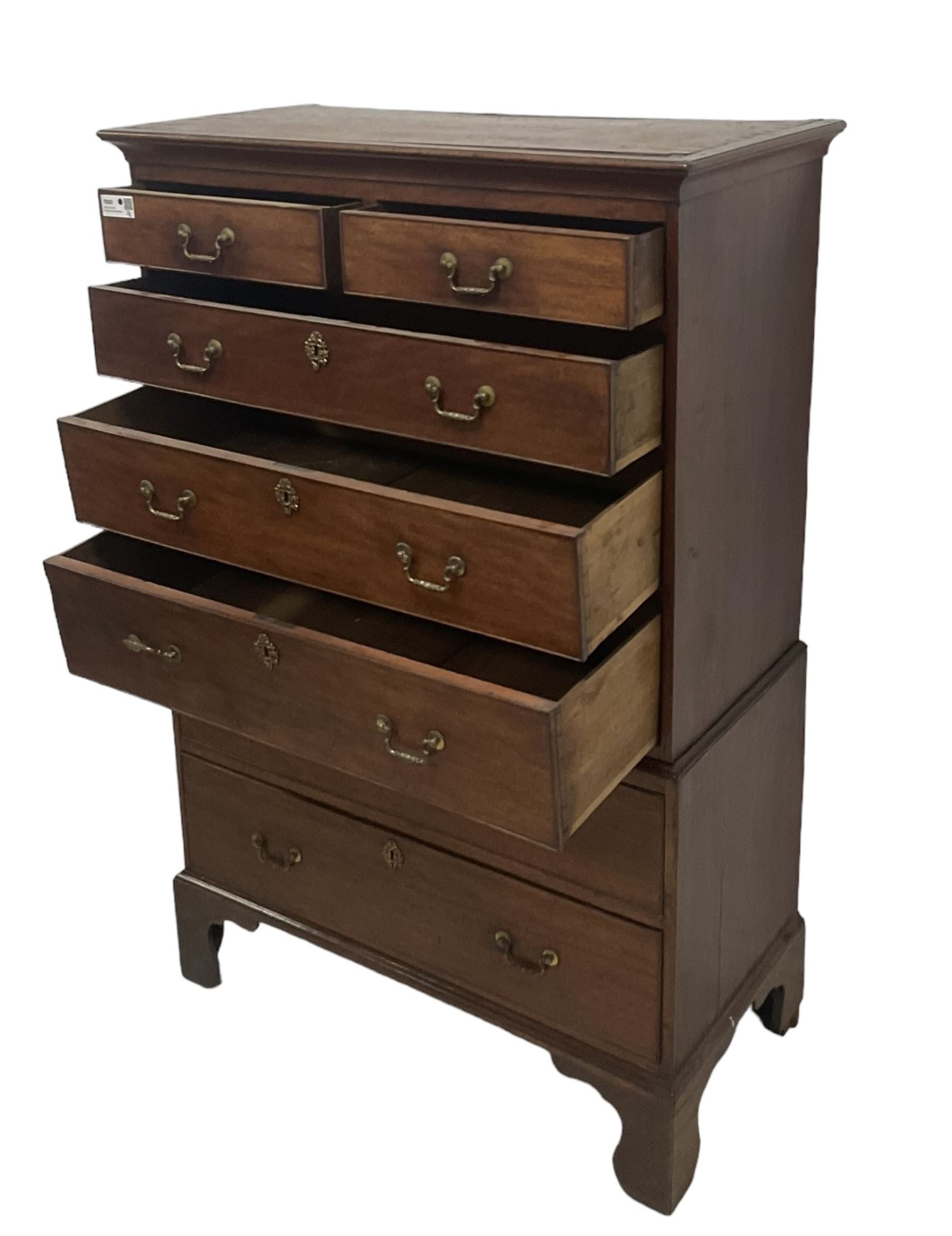 George III mahogany chest-on-chest, projecting cornice over two short and five long graduating cock-beaded drawers, each fitted with original brass swan neck handles, raised on bracket feet