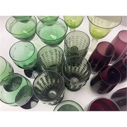 Set of four Swedish Reijmyre drinking glasses, with textured outer surface, together with green drinking glasses including Holmegaard examples and other glassware