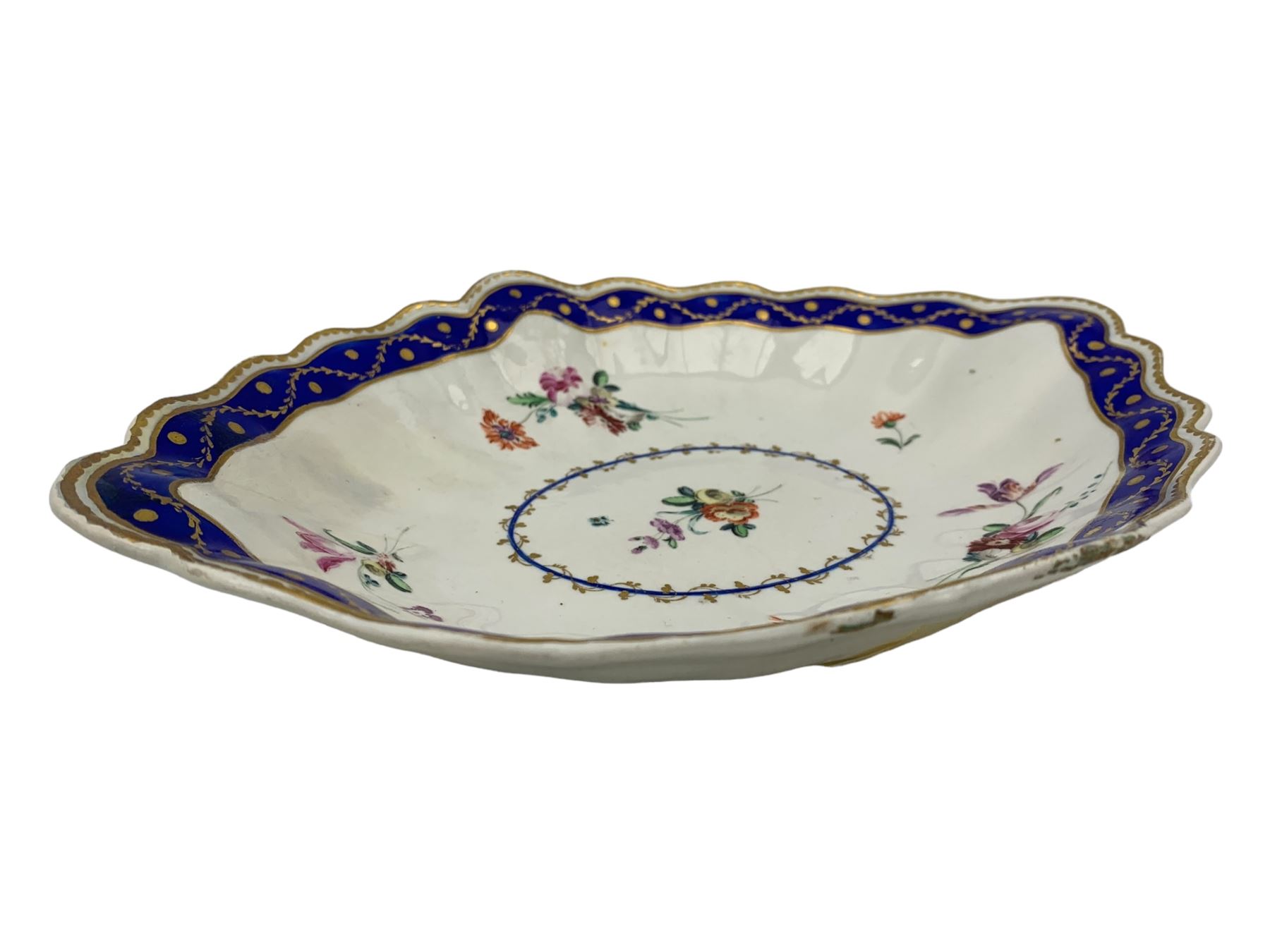 18th century Derby fluted lozenge shaped dish, in the manner of Edward Withers, painted with flower sprays within a blue and gilt leafy chain border, crown over D in blue, incised N, L26cm 