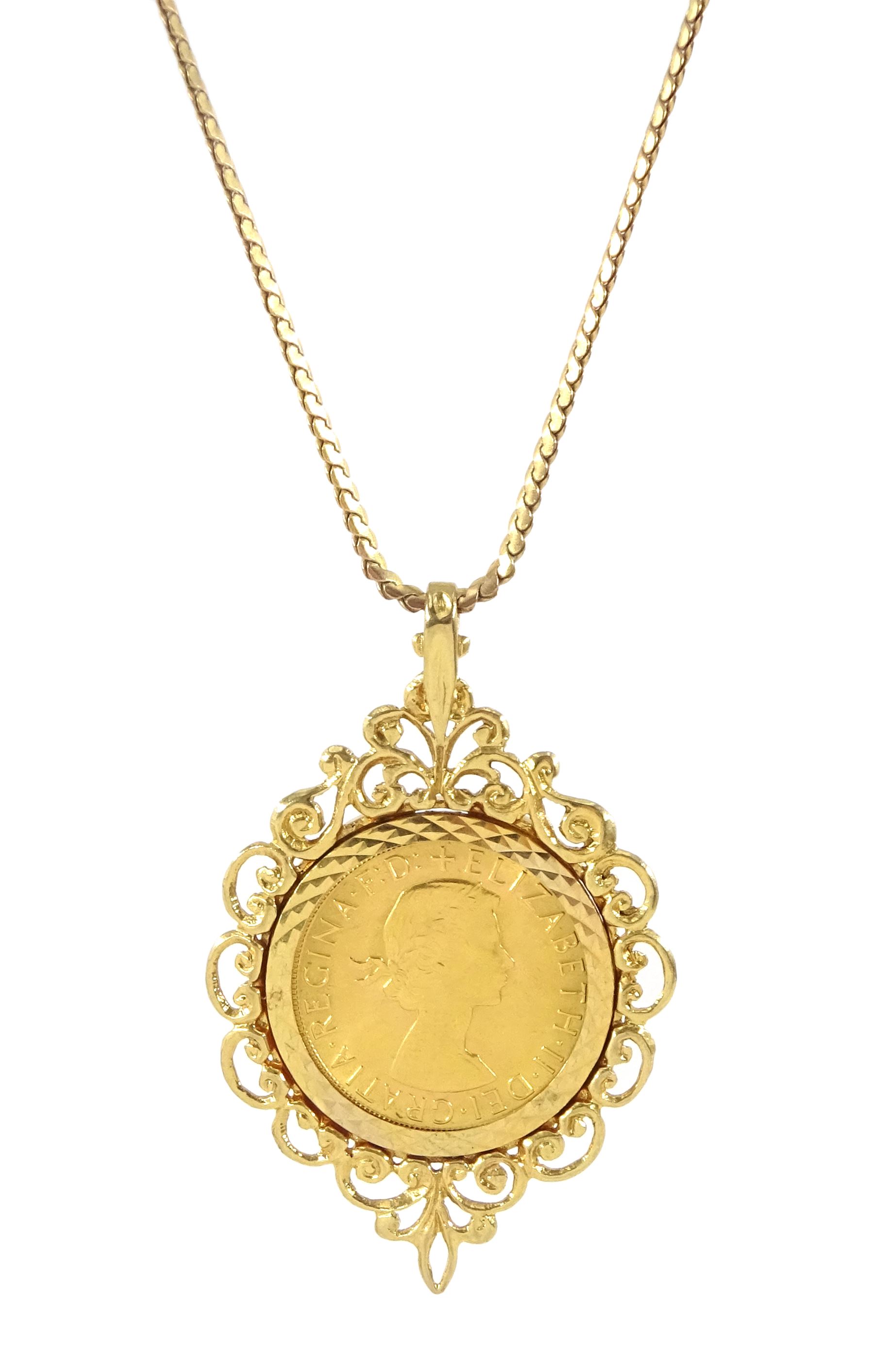 Queen Elizabeth II 1968 gold full sovereign coin, loose mounted in gold pendant, on gold flattened link chain necklace, both hallmarked 9ct