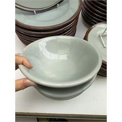 20th century celadon dinner service with iron rim, comprising nineteen dinner plates 26.5cm, twenty-four side plates D24cm, twelve varying bowls, twenty-two tea plates and fifteen saucers 