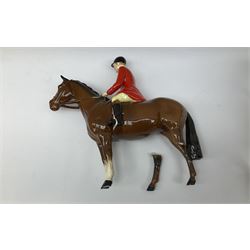 Beswick Hunting Group, comprising: two huntswoman on grey horses, model no 1730, huntsman on a bay horse, model no 1501, a seated fox, model no 1748, eighteen fox hounds and a spaniel, model no 967, all with printed marks beneath, together with three other ceramic huntsman on horseback and two hounds. 