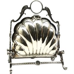 19th/ early 20th century silver-plated biscuit box, of shell form with two fold down compartments with pierced fretwork design covers, on four scroll feet, H27cm 