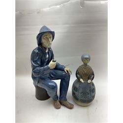 Lladro figure, Girl in Traditional Dress no 1159, together with Nao figure Old Fisherman Smoking a Pipe