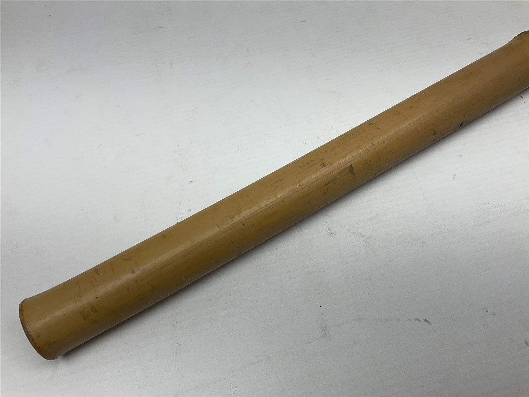 Bamboo cane torch, the pierced brass cover opening to reveal a wick, H144cm